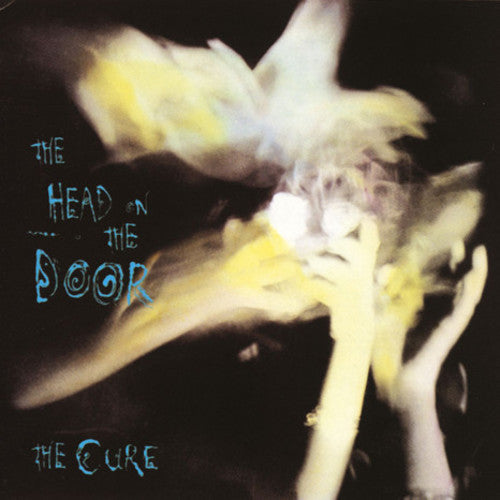 the album cover for The Cure - The Head on The Door [Vinyl]